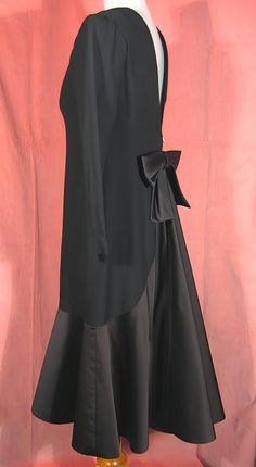 "Dramatic 70's cocktail dress in black crepe and satin by Estevez, who was the youngest designer to win the Coty award. Beautifully made, it's completely lined, and about a size 6. It measures approx. 14\" across slightly padded shoulders, up to 37\" bust, 20 1/2\" outside sleeve length, 28\" waist, 38\" hips, and 43\" overall length. It's in excellent, like new, condition. See my entire shop collection here https://www.etsy.com/shop/RobinClaytonVintage" Black Silk A-line Evening Dress, Vintage Black Evening Dress For Night Out, Black Silk Evening Dress For Formal Occasions, Black Silk Evening Dress For Party, Formal Black Silk Evening Dress, Black Silk Cocktail Evening Dress, 1920s Hat, Flapper Girl, Hat Stands