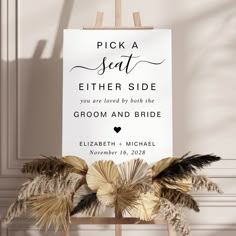 a sign that says pick a seat either side, you are loved by both the groom and bride