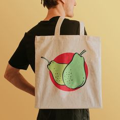 Check out our exclusive Fruit Fiesta Canvas Grocery Tote! Say goodbye to single-use plastic bags and hello to a stylish and eco-friendly shopping companion. This durable canvas tote features vibrant and exclusive images of cherries, grapes, peaches, pears, and strawberries that will add color to your grocery runs. With comfortable shoulder straps and a spacious interior, this tote is perfect for carrying fresh produce, pantry staples, or almost anything. Make a statement while reducing your envi Produce Pantry, Market Bags, Grocery Tote, Pantry Staples, Market Tote, Plastic Bags, Market Bag, Fresh Produce, Large Canvas