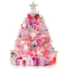 a pink christmas tree with presents under it