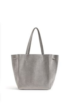 KWONN Shopper is made with vegan and sustainable performance fabric that's durable and easy to clean. The Shopper can be worn as a large shoulder bag or as a smaller size ​bucket bag by pulling the ​drawstring ​at the center of the bag. The exterior of the bag has a subtle shine coating, and the inner material features a softer texture with an uncanny suede feel. Each bag is handmade in New York by a master artisan. Fits up to 15" laptops. Ultra-lightweight, No lining, Hardware-free. Everlasting Grey Crossbody Bag, Grey Tote, Grey Bag, Blue Tote, Large Shoulder Bags, Black Crossbody, Black Tote, Shopper Bag, Performance Fabric