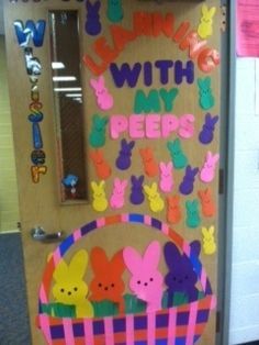 a door decorated with peeps and bunny ears