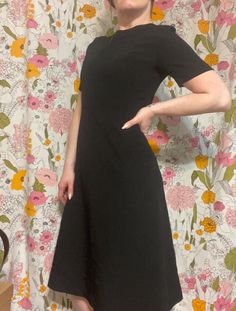 Really nice well made vintage dress with no flaws to note!! Clean and ready to wear! I do not have the original belt, but most any belt will do. Fully lined -  Bust measures 35in and waist measures 29in-   Length is 43in Classic Black A-line Vintage Dress, Black Short Sleeve Midi Dress For Semi-formal, Black Short Sleeve Midi Dress For Semi-formal Occasions, Classic Vintage Midi Dress For Formal Occasions, Black Knee-length Vintage Dress, Classic Vintage Midi Length Dress For Evening, Classic Vintage Midi Dress For Evening, Classic Vintage Midi Evening Dress, Elegant Knee-length Vintage Dress For Work