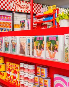 the shelves are full of magazines and other items for sale in a store or restaurant