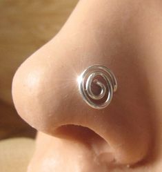 This nose ring is made of 20 gauge silver plated and is tarnish resistant which is good for pircings. The wire allows you to adjust to fit tour nose. This design fits the right or left side. The spiral is 0.2 inch (5mm) dimension. Please check out my policies and contact with any questions. Spiral Nose Ring, Crazy Piercings, Stud Nose Piercing, Nose Jewels, Septum Earrings, Unique Nose Rings, Sterling Silver Nose Rings, Nose Piercing Hoop, Nose Piercing Stud