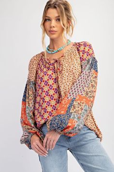 Patchwork patterned long sleeve top in regular and curvy sizes. Light weight. Tie v-neckline. Puffy balloon sleeves. This boho top is so cute and pairs well with jeans or even a long skirt! Runs true to size, model is wearing a small. Brand: Easel Materials: 100% Rayon Topshop Plus, Umgee Clothing, Thml Clothing, Umgee Tops, Love Clothing, Boho Top, Boho Print, Floral Print Blouses, Sweater Making