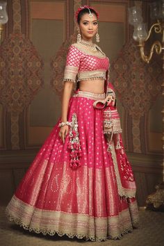 Rani pink attached cancan lehenga with paisley, floral banarasi woven motifs and gota, dori, badla embroidered border. Paired with neckline embroidered padded blouse and scallop embroidered dupatta. - Aza Fashions Pink Banarasi Silk Sharara For Reception, Pink Banarasi Silk Dupatta For Reception, Pink Meenakari Anarkali Set For Reception, Pink Meenakari Dupatta For Reception, Pink Meenakari Sets For Reception, Pink Chandbali Lehenga For Diwali, Designer Pink Banarasi Silk Lehenga, Pink Banarasi Silk Sets For Reception, Pink Banarasi Silk Saree With Tilla Detailing