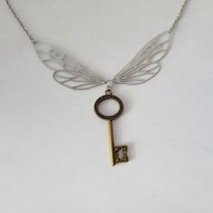 "This whimsical necklace features a pair of stainless steel wings with a little bronze key dangling underneath them.  The keys from the outer tip of one to the outer tip of the other is 4\" wide.  The key dangling from where the wings meet is a touch over 1 1/2\" long.  This necklace is available in many lengths and you can choose from 16 18 20 22 24 or 30\".  The chain is made of stainless steel and finished with a lobster claw style clasp. Thanks!" Whimsical Necklace, Skeleton Key Necklace, A Skeleton, Friend Necklaces, Skeleton Key, Key Necklace, The Wings, The Keys, You Choose