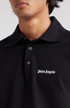 The Milanese label's gothic logo is embroidered at the chest of this classic polo made from soft, breathable cotton. 28" length (size Medium) Button half-placket Spread collar Short sleeves 100% cotton with 100% polyester embroidery Dry clean or machine wash, dry flat Made in Italy Designer Clothing Classic Polo Shirt With Ribbed Collar For Streetwear, Classic Black Top With Logo Patch, Classic Polo Shirt With Logo Print For Streetwear, Collared Polo Shirt With Logo For Streetwear, Streetwear Collared Polo Shirt With Logo Print, Designer Black Cotton Polo Shirt, Classic Polo Shirt With Embroidered Logo For Streetwear, Classic Collared Polo Shirt With Logo, Black Cotton Polo Shirt With Embroidered Logo