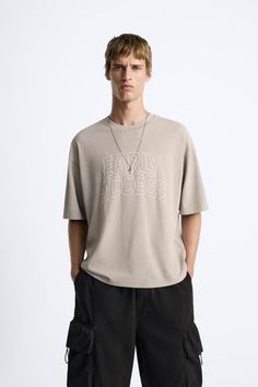 EMBROIDERED TEXT T-SHIRT - Gray | ZARA United States Short Sleeve T-shirt With Letter Embroidery For Streetwear, Casual Summer T-shirt With Embroidered Graphics, Zara Summer T-shirt With Text Print, Zara Crew Neck T-shirt With Relaxed Fit, Trendy Zara T-shirt For Streetwear, Trendy Crew Neck T-shirt With Embroidered Text, Zara T-shirt With Letter Print For Spring, Summer Short Sleeve T-shirt With Embroidered Text, Zara T-shirt With Letter Print And Relaxed Fit