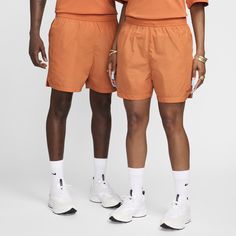 These premium shorts feature stretch fabric for comfort and mobility. Nylon Swim Trunks With Built-in Shorts, Sportswear Nylon Bottoms With Built-in Shorts, Nike Athletic Nylon Shorts With Elastic Waistband, Nike Nylon Bottoms With Elastic Waistband, Nike Shorts With Built-in Liner For Spring, Relaxed Fit Nylon Swim Trunks For Athleisure, Athleisure Swim Trunks With Relaxed Fit, Athleisure Swim Trunks With Relaxed Fit And Short Length, Athleisure Relaxed Fit Short Swim Trunks