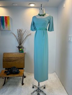 1960s dress / 1960s gown / 60s dress / vintage gown  / 1960s fashion  / vintage dress / vintage maxi gown This late 1960s gown is beautiful and comfortable, two things that make a dress perfect! . She is a  floor length gown with so much class. Her bodice is classy with 3/4 length sleeves, and a satin trimmed empire waist with gorgeous hip pleating.  She has a long center back metal zipper and a strong desire to get out in the world.  Measurements provided are flat and have been doubled. Please note this dress is meant to hang off the bust line and not cling to the waist. It is meant to have a loose fit so that when you move, it moves with you. Absolutely gorgeous on a real human.  Bust 32" empire Waist 26" natural waist 32" Hips 37"  Length 54.5" shoulders 14" size XS  ❤️ Condition: Excel Retro Formal Maxi Dress, Retro Maxi Length Formal Dress, Elegant Spring Maxi Dress For Vintage Fashion, Vintage Evening Dress For Spring Formal Events, Vintage Floor-length Cocktail Evening Dress, Elegant Vintage Fashion Maxi Dress, Spring Retro Formal Maxi Dress, Spring Formal Retro Maxi Dress, Retro Maxi Dress For Wedding