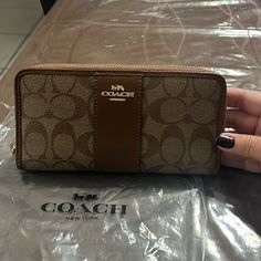 Coach Signature Khaki Saddle Zip Accordian Long Wallet. Brand New, Tags Were Removed. Designer Brown Bag With Card Slots, Brown Rectangular Wallet With Zipper Closure, Designer Wallets With Zipper Closure For Daily Use, Designer Brown Clutch Wallet, Brown Everyday Wallet With Zipper Closure, Brown Bifold Bag With Interior Card Slots, Beige Pouch Wallet With Interior Card Slots, Formal Brown Wallet With Removable Pouch, Coach Leather Pouch Wallet