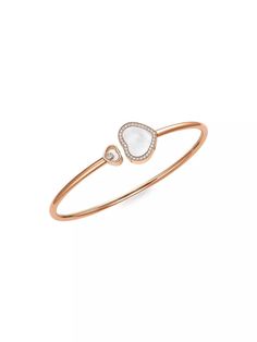 From the Happy Diamonds Collection. Symbolic heart bangle with signature floating diamond..Diamonds, 0.19 tcw.18K rose gold.Mother-of-pearl.Slip-on style.Imported.SIZE.Diameter, about 7'.ABOUT THE BRAND.In 1860, artisan watchmaker Louis-Ulysse Chopard founded the renowned jewelry brand in Sonvilier, Switzerland. The company is known for its legendary Swiss watches and classic high fine jewelry designed to last a lifetime..From the Happy Diamonds Collection. Symbolic heart bangle with signature floating diamond.Diamonds, 0.19 tcw18K rose goldMother-of-pearlSlip-on styleImportedSIZEDiameter, about 7'ABOUT THE BRANDIn 1860, artisan watchmaker Louis-Ulysse Chopard founded the renowned jewelry brand in Sonvilier, Switzerland. The company is known for its legendary Swiss watches and classic high Chopard Bracelet, Chopard Happy Diamonds, Diamonds Collection, Chopard Jewelry, Pearl Bangle, Happy Heart, Jewelry Brand, Fine Jewelry Designers, Bangles Jewelry