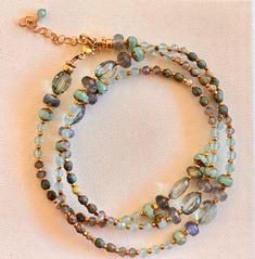 Thisulti purpose piece has many high end gemstones, aqua marine, turquoise, labradorite, green amethyst, all the findings and chain is made with gold fill This bracelet/necklace is 21 inches long with an adjustable clasp and chain to fit all sizes, the bracelet will wrap around the wrist 3 times. Aqua Marine, Green Amethyst, Adjustable Necklace, Crafty Stuff, Bracelet Necklace, Wrap Around, Aquamarine, Wrap Bracelet, Halloween Shopping