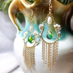 Perfect to style when want go out and add a statement to your look. with these lovely handcrafted earrings, very light and comfortable to wear ❤️M A T E R I A L : - Freshwater pearl - Japanese beads - Royal green blue Czech glass teardrops - S925 gold filled hook - 14K Gold filled cershain ❤️ A B O U T Me All pieces are designed and made by me in Australia. I am in love with the wild botanical, Therefore i want to bring inspiration to everyone that loves nature. ❤️ P A C K A G I N G - All items Bohemian Chandelier Earrings With Pearl Drop, Bohemian Chandelier Pearl Drop Earrings, White Dangle Tassel Earrings With Pearl Drop, White Pearl Drop Dangle Tassel Earrings, White Bohemian Teardrop Earrings For Pierced Ears, White Bohemian Teardrop Earrings, Bohemian Beaded Drop Earrings With Pearl, Elegant Tassel Teardrop Earrings, Elegant Teardrop Tassel Earrings