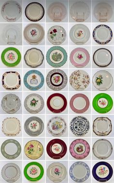 many plates are arranged in rows on the wall