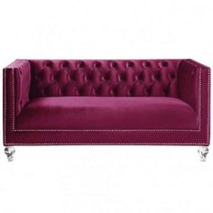 a purple couch with silver legs and buttons