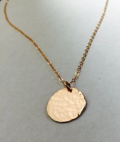 This listing is for a 14K gold filled, 14K rose gold filled, or sterling silver disc pendant and chain. -Delicate, high-quality 14k gold filled, 14k rose gold filled, or sterling silver disc pendant and chain.-This is a medium sized disc and is 15mm.-Choose either hand hammered as shown or smooth finish for the disc. This item will be delivered in a gift box ready for gift giving. Yellow Gold Coin Necklace With Nickel-free Round Pendant, Nickel-free Yellow Gold Coin Necklace With Round Pendant, Rose Gold Tarnish Resistant Round Pendant Jewelry, Tarnish Resistant Rose Gold Round Pendant, Rose Gold Tarnish Resistant Round Pendant, Gold Round Coin Necklace Nickel Free, Hammered Round Disc Coin Necklace As Gift, Hammered Coin Necklace As Gift, 14k Gold Nickel-free Round Pendant