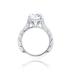 a diamond engagement ring on a white background