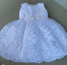 Elegant Lace Bodice Dress For First Communion, Sleeveless Lace Princess Dress For Wedding, Elegant Lace Dress For Baptism Party, Elegant Princess Dress With Lace Trim, Lace Bodice Baptism Dress, White Elegant Princess Dress With Lace Trim, Lace Baptism Dress With Lace Bodice, Elegant Sleeveless Lace Princess Dress, Elegant Lace Dress For Baptism