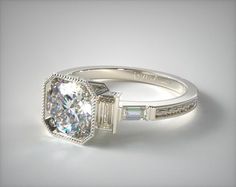 an engagement ring with a cushion cut diamond surrounded by baguets on the sides