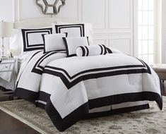 black and white comforter set on a bed