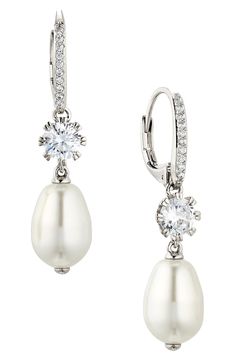 Lustrous imitation-pearl drops dangle from these cubic zirconia-illuminated earrings that add an elegant flourish to your special-occasion look. 1 1/4" drop; 1/4" width Lever-back closure Imitation pearl/rhodium plate/cubic zirconia Imported Silver Pearl Earrings, Earrings Teardrop, Pearl Earring, Pearl Drop Earrings, Wedding Looks, Silver Pearls, Pearl Drop, Wedding Earrings, Rhodium Plated