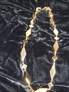 "This is an estate find that appears to have not been worn much. It's a very substantial 15\" choker by Monet that weighs 2.5oz. very bright shiny gold with geometric pattern. Interesting it has an extender on it that I have not seen before - also marked Monet so it can be taken off which makes it a 14\" necklace." Gold Necklace 16 Inch For Party, Gold 16 Inch Costume Jewelry Necklace, Gold 16 Inch Costume Jewelry, 16 Inch Gold Costume Jewelry Necklace, Metal Jewelry For Formal Occasions, 16 Inch Metal Jewelry For Formal Occasions, Diamond-shaped Gold Jewelry For Party, Gold Diamond-shaped Party Jewelry, Formal 16 Inch Metal Jewelry