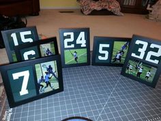 four frames with numbers on them sitting on a table