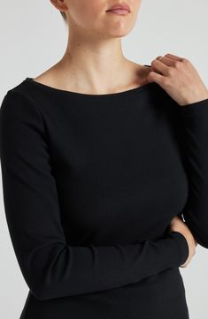 It’s the perfect layering piece, cut from the softest fabric you have ever felt. Featuring a classic boat neckline, long fitted sleeves, and a body-hugging fit throughout, it’s perfect on its own or under a sweater for extra warmth.   At LOSANO we help elevate every moment with clothing that is better for you! Boat Neck Hip length Scoop hem Buttery-soft ribbed fabric PFA Free BPA Free Moisture Wicking Breathable Enhanced Color Protection Made from sustainable materials Fits true to size 47% supi Elegant Boat Neck Tops For Fall, Fitted Boat Neck Top For Fall, Elegant Boat Neck Top For Layering, Black Breathable Tops In Seamless Fabric, Casual Black Long Sleeve Fine Knit Top, Black Cotton Relaxed Fit Long Sleeve Top, Elegant Black Boat Neck Top, Fitted Boat Neck Winter Tops, Fitted Black Top With Boat Neck