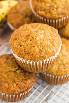 several banana muffins cooling on a rack