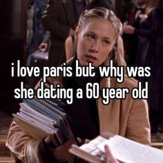 a woman holding books in her hands with the caption i love paris but why was she