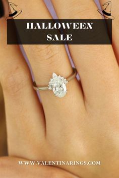 a woman's hand with an engagement ring on it and the words halloween sale written in