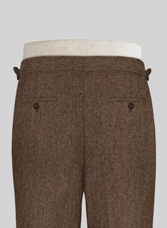 If you're trying to smarten your look or simply want to mix up your office outfit, you can try our Rust Herringbone Tweed Highland Trousers, as they are extremely versatile. Crafted from wool, a piece of clothing that people originally saw as stereotypically old is now one of the most stylish items a man can own. 
 
 Look Includes  Rust Herringbone Tweed Fabric  Cross Pocket  Forward 2 Pleats  Side Tabs (No Loops)- Arrow Shape  Bottom Cuff (1.5")  Two Welted Back Pockets on Trousers   You can ch Grey Tweed Suit, Herringbone Tweed Jacket, White Linen Suit, Green Velvet Jacket, Peaky Blinders Suit, Tweed Outfit, Royal Blue Suit, Fabric Cross, Tweed Trousers