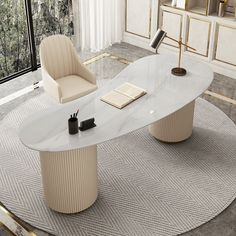 an oval table with two chairs and a book on it