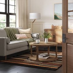 a living room scene with focus on the couch and coffee table in the center area