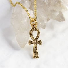 "Gold Ankh Necklace, Egyptian cross Jewelry, eternal life Symbol of Life Layering Necklace, Personalized Initial Charm, Mother's day gift Listing is for the solo Ankh charm necklace on a gold chain. You can personalize this necklace, by: ADDING initial charms here: https://etsy.me/2ZypsB3 ADDING Swarovski birthstones here: https://etsy.me/356yFBC Cross is 7/8\" long, it's a delicate small cross necklace. The Ankh cross was a very powerful Ancient Egyptian symbol for eternal life and good health. Small Cross Necklace, Boho Valentine, Egyptian Cross, Ancient Egyptian Symbols, Ankh Necklace, Ankh Cross, Egyptian Symbols, Snake Jewelry, Life Symbol