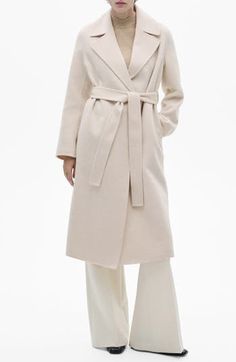 Add timeless worth with a wool-blend wrap coat turned out in a snowy shade. Open front Notched lapels Side-seam pockets Back vent Removable sash Lined 53% wool, 46% polyester, 1% acrylic Dry clean Imported Chic Spring Wool Coat With Belt, Chic Belted Wool Coat, Chic Belted Beige Wool Coat, Chic Wool Coat With Shawl Collar, Chic Winter White Wool Coat For Work, Elegant Neutral Wool Coat For Winter, Elegant Belted Wool Coat For Spring, Elegant Spring Wool Coat With Belt, Chic Beige Wool Coat