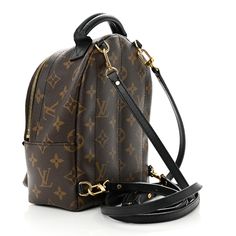 This is the authentic LOUIS VUITTON Monogram Palm Springs Backpack Mini. This petite backpack is crafted of classic monogram coated canva in brown with black calfskin leather trim. The backpack features a padded black leather top handle, optional adjustable shoulder straps, and a front zipper pocket. The brass wrap-around zipper opens to a black fabric interior with a patch pocket. Louis Vuitton Monogram Bag, Louis Vuitton Backpack, Black Leather Top, Classic Monogram, Monogram Bag, Louis Vuitton Damier Ebene, Palm Springs, Leather Top, Authentic Louis Vuitton