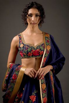 Editor's Note Chanderi Silk Lehenga With Resham Thread Embroidery And Hand Embroidery Work Paired With Chanderi Silk Embroidered Dupatta & Blouse Color: Indigo Fabric: Chanderi Silk Care: Dry Clean Only About the Designer Rohit Bal is intensely concerned with design as an art form. The designer draws on history, fantasy and folklore to create masterpieces that are desired by discerning aficionados around the globe. Rohit has a deep understanding of the psyche of the fashion world and it reflects Chanderi Silk Lehenga, Floral Bridal Lehenga, Hand Embroidery Work, Rohit Bal, Embroidered Lehenga, Indigo Fabric, Embroidered Dupatta, Silk Lehenga, Floral Bridal