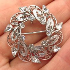 925 Sterling Silver Vintage Carl Art Rhinestone Filigree Leaf Design Pin BroochWeight: 5.8gWELCOME TO PAWN SHOPWe are an actual pawn shop and have been in business for over 25 years.Since 1990, our establishment has been serving a variety of clients by providing them with short term cash solutions and options of liquidity regarding their treasured heirlooms.Acknowledging that today′s customers are very sophisticated and are looking for a variety of investments, our acquisitions are hand-picked f Silver Rhinestone Brooches For Anniversary, Silver Crystal Brooches As Gift, Silver Crystal Brooches For Gift, Silver Crystal Brooches For Anniversary, Formal Silver Cubic Zirconia Brooches, Silver Crystal Brooch For Anniversary, Silver Crystal Anniversary Brooches, Silver Cubic Zirconia Jewelry With Brooch, Silver Cubic Zirconia Brooches For Formal Occasions