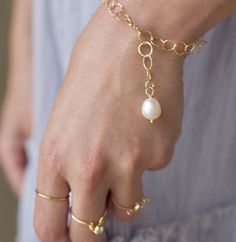 This genuine pearl bracelet is so simple, but super elegant. A generously-sized genuine pearl decorates a delicate textured 14k gold filled chain.  This bracelet is adjustable.  Please measure your wrist and order the perfect size for your needs.  This bracelet is secured and adjusts to any one of the large chain loops, to create your favorite layered look.- Genuine Freshwater Pearl - 14k Gold Filled Chain - lovely gift box included____________________________P R O D U C T I O N - T I M EPlease Adjustable Pearl Bracelet With Pearl Pendant For Wedding, Delicate Pearl Charm Bracelet Jewelry, Elegant 14k Gold-filled Bracelet With Extender, Elegant 14k Gold Filled Bracelet With Extender, Delicate Gold Chain Bracelet With Pearl Charm, Elegant Gold Bracelet With Pearl Drop For Wedding, Elegant Wedding Chain Bracelet With Extender, Gold Minimalist Pearl Bracelet With Extender, Minimalist Gold Pearl Bracelet With Extender