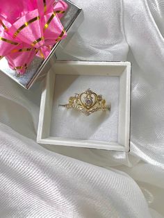 This beautiful Quinceañera crown ring is made with real 14k GOLD. Doesn't have the 15 so could be versatile. Detailed with CZ stones.  Feel free to message with any questions or concerns! Sizing is free! Message if you need a size that is not listed below. Promise Ring Jewelry With Crown Design And Open Shape, Crown Design Open Promise Ring, Gold Crown Shaped Diamond Ring, Luxury Anniversary Ring With Crown Design, Luxury Crown Design Rings For Anniversary, Luxury Anniversary Rings With Crown Design, Open Ring With Crown Design For Promise, Crown Shaped Cubic Zirconia Rings For Anniversary, Princess Style Cubic Zirconia Wedding Jewelry