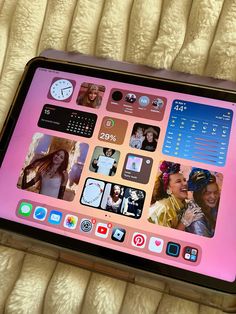 an ipad is sitting on top of a bed with many different app icons and buttons