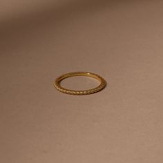 The perfect dainty gold ring everyone needs. Crafted with 18k gold over sterling silver, our Rope Vermeil Ring is the ultimate stacking piece. Layer this rope ring with itself or with any of your other favorite gold rings. For an elegant ring stack, pair this gold band with our Simplistic Vermeil Ring. Dainty 14k Gold Rope Chain Jewelry, Classic 14k Gold Delicate Rope Chain Necklace, Minimalist 14k Gold Engraved Ring, Tarnish Resistant, Gold Rope Ring, Classic Adjustable Stackable 14k Gold-filled Rings, Rope Rings, Dainty Gold Rings, Black Gift Boxes, Vermeil Jewelry