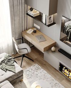 a living room with a couch, coffee table and laptop on top of the desk