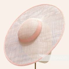 *This is not a fitted hat! You will need to attach a headband, comb or elastic to secure it to your head* This pale pink cartwheel hat base is a classic shape that has sprung into popularity in the past year. Made from 2 layers of stiffened sinamay, these cartwheels are ready to trim and are fitted with a petersham ribbon on the inside crown edge. Simply add a comb or headband to secure to the head. Hat base measures: Width: 35.5cm (14 inches) Crown Width: 13.5cm (5.3 inches) Crown Height: Approximately 3.5cm (1.7 inches) In this listing we give you the option of attaching an elastic, this is to help secure the fascinator base to your head as it is not a fitted/finished headpiece. If you would prefer to use a headband or a comb, these can be purchased separately in our shop for you to sew Classic Pink Hat With Curved Brim, Fitted Hat With Round Crown For Kentucky Derby, Classic Adjustable Pink Hat, Summer Fascinator With Round Crown, Adjustable Round Crown Mini Hats For Kentucky Derby, Elegant Fitted Summer Bonnet, Adjustable Hat With Round Crown For Summer, Elegant Adjustable Bonnet For Summer, Classic Pink Wide Brim Hat