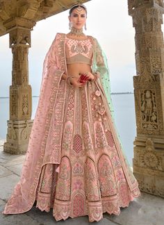 Traditional Bridal Peach Silk embroidered lehenga choli AA139Desc: Style : Circular Lehenga Color : Peach Fabric : Silk  Work :Haevy Embroidery Wash Care : Dry clean Sleeve Style : Half Sleeve Long Sleeves : Done only in Custom Stitch Sleeves Lining : Done only in Custom Stitch Bust Size : 32 to 42 Inches Occasion : Wedding Mehendi Engagement Reception Ceremonial Baby Shower Party Wear: Double dupatta .Semi stitch lehenga choli.Size till 42 inch.heavy bridal lehenga choli Pi...