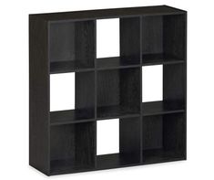 a black book shelf with four squares on the front and two white squares on the back